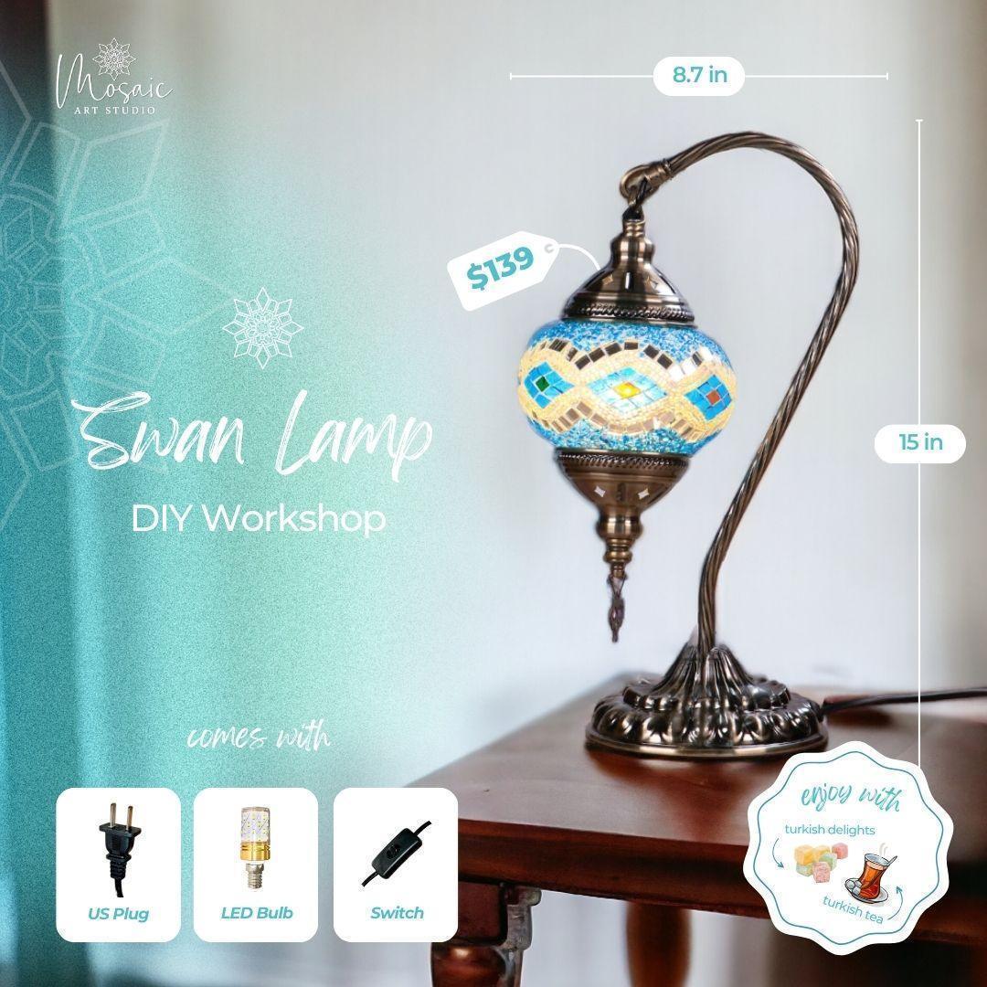 Decorative Swan Lamp with blue mosaic glass shade on bronze ornate stand on wooden table