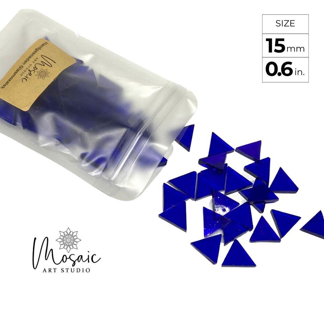 15mm hand-cut blue triangle glass mosaic tiles spilling from matte pouch by Mosaic Art Studio